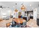 Open-concept layout with a dining area, kitchen with island, and cozy living space. Perfect for modern living at 34266 Radley Way, Wesley Chapel, FL 33545