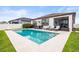 Beautiful pool featuring a sun shelf and white stone surroundings at 34266 Radley Way, Wesley Chapel, FL 33545
