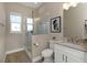 This bathroom features a glass shower, decorative art, and a granite countertop on the vanity at 4139 Rocky Shores Dr, Tampa, FL 33634