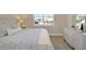 Bright bedroom features wood floors, dresser with mirror, and plenty of natural light at 4139 Rocky Shores Dr, Tampa, FL 33634