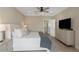 Comfortable bedroom featuring a dresser and doorway leading to the bathroom and walk-in closet at 4139 Rocky Shores Dr, Tampa, FL 33634