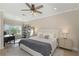 Bright bedroom with neutral tones, a large window, and a cozy seating area at 4139 Rocky Shores Dr, Tampa, FL 33634