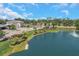 Beautiful lakeside community featuring well-manicured lawns, lush landscaping, and a tranquil fountain at 4139 Rocky Shores Dr, Tampa, FL 33634