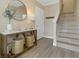 Entryway with ceramic tile floors, console table, staircase, and neutral paint colors at 4139 Rocky Shores Dr, Tampa, FL 33634
