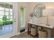 A sunlit entryway offers tile floors, console table, decorative accents and a view to the outdoors at 4139 Rocky Shores Dr, Tampa, FL 33634