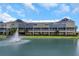 Rear view of townhomes overlooking the lake, showcasing the attractive architecture at 4139 Rocky Shores Dr, Tampa, FL 33634