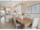 Modern kitchen with white cabinetry, stainless steel appliances, and open access to the dining area at 4139 Rocky Shores Dr, Tampa, FL 33634