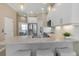 Well-equipped kitchen with white cabinets and stainless steel appliances; access to the bedroom at 4139 Rocky Shores Dr, Tampa, FL 33634