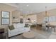 Open concept living room with kitchen, dining area, neutral color palette and hardwood floors at 4139 Rocky Shores Dr, Tampa, FL 33634