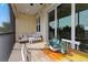 Cozy screened patio with dining table, seating area, and outdoor view at 4139 Rocky Shores Dr, Tampa, FL 33634