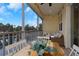 Screened patio featuring a dining table, stylish furniture, string lights, and a lovely view of the lake at 4139 Rocky Shores Dr, Tampa, FL 33634