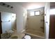 Bathroom featuring a tub and shower, with neutral-toned tile and a vanity at 4214 Longfellow Dr, Plant City, FL 33566