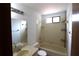 Bathroom featuring a tub and shower, with neutral-toned tile and a vanity at 4214 Longfellow Dr, Plant City, FL 33566