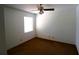 A cozy bedroom featuring neutral walls, carpet, and a window at 4214 Longfellow Dr, Plant City, FL 33566