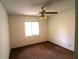 Cozy bedroom with a ceiling fan and bright natural light from the window at 4214 Longfellow Dr, Plant City, FL 33566