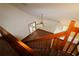 View of the staircase leading to a living area with carpet and ceiling fan at 4214 Longfellow Dr, Plant City, FL 33566