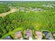 An aerial view of the homes with a golf course and forest land nearby at 4227 Sandy Shores Dr, Lutz, FL 33558