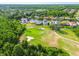 Aerial view of homes backing to a golf course, lush greenery and mature landscaping at 4227 Sandy Shores Dr, Lutz, FL 33558