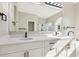 Bathroom featuring double sinks, granite countertops, and a glass shower at 4227 Sandy Shores Dr, Lutz, FL 33558