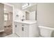Modern bathroom featuring white cabinets, quartz countertop, sleek fixtures, and a bright, airy design at 4227 Sandy Shores Dr, Lutz, FL 33558