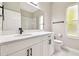 Bathroom featuring a vanity with quartz countertop, modern fixtures, and a walk-in shower at 4227 Sandy Shores Dr, Lutz, FL 33558