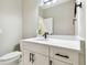 Modern bathroom featuring white vanity, quartz countertop, sleek fixtures, and a toilet at 4227 Sandy Shores Dr, Lutz, FL 33558