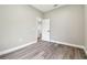 Bright, empty bedroom with modern flooring; freshly painted with white trim, awaiting personalization and decor at 4227 Sandy Shores Dr, Lutz, FL 33558