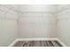 Walk-in closet with wood floor and wire shelving at 4227 Sandy Shores Dr, Lutz, FL 33558