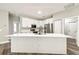 Modern kitchen with white cabinets, stainless steel appliances, and a center island at 4227 Sandy Shores Dr, Lutz, FL 33558