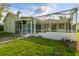Enclosed patio with plenty of space perfect for entertaining or enjoying the outdoors at 4227 Sandy Shores Dr, Lutz, FL 33558