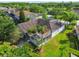 This residence features a screened-in lanai with palm trees and a well-maintained lawn at 4227 Sandy Shores Dr, Lutz, FL 33558