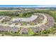 Picturesque aerial view of a neighborhood surrounding a tranquil lake offering a serene living environment at 4329 Barletta Ct, Wesley Chapel, FL 33543