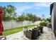 Charming backyard featuring a fire pit and outdoor seating area at 4329 Barletta Ct, Wesley Chapel, FL 33543