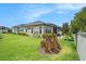 Exterior view of a home with a well-manicured lawn and tasteful landscaping at 4329 Barletta Ct, Wesley Chapel, FL 33543