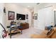 Cozy room featuring a drum set, large-screen TV, and comfortable seating at 4329 Barletta Ct, Wesley Chapel, FL 33543