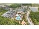 Aerial shot showcasing a luxurious community pool, tennis courts and recreational facilities surrounded by lush landscapes at 4329 Barletta Ct, Wesley Chapel, FL 33543