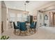 An inviting dining room with tile floors, chandelier, and seating for six at 4329 Barletta Ct, Wesley Chapel, FL 33543