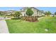 Beautiful home with a green lawn, landscaping, and a multi-car garage at 4329 Barletta Ct, Wesley Chapel, FL 33543