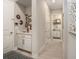 Hallway featuring a built-in vanity with decorative accents and access to a bathroom at 4329 Barletta Ct, Wesley Chapel, FL 33543