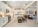 An eat-in kitchen featuring an island with seating, stainless appliances, and white cabinets at 4329 Barletta Ct, Wesley Chapel, FL 33543