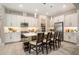 A bright kitchen featuring stainless appliances, a breakfast bar, and white cabinets at 4329 Barletta Ct, Wesley Chapel, FL 33543