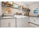 Bright laundry room with modern appliances and ample counter space at 4329 Barletta Ct, Wesley Chapel, FL 33543
