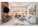 A stylish living room with a fireplace, modern decor, and an open floor plan at 4329 Barletta Ct, Wesley Chapel, FL 33543