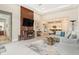 An open-concept living room with modern decor, a fireplace, and tile flooring at 4329 Barletta Ct, Wesley Chapel, FL 33543