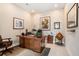 Home office featuring a large desk, decorative brick wall, and professional decor at 4329 Barletta Ct, Wesley Chapel, FL 33543