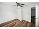 Bedroom featuring dark wood-look floors and a ceiling fan at 4727 17Th S Ave, St Petersburg, FL 33711