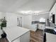 Bright kitchen with white cabinetry, stainless steel appliances, and a breakfast bar at 4727 17Th S Ave, St Petersburg, FL 33711