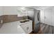 Kitchen area with stainless steel refrigerator, undermount sink, and gray subway tile at 4727 17Th S Ave, St Petersburg, FL 33711
