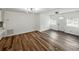 Open living space featuring wood-look floors, white walls, and a front door view at 4727 17Th S Ave, St Petersburg, FL 33711