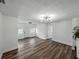 Spacious living room with modern flooring, neutral walls, modern lighting, and ample natural light at 4727 17Th S Ave, St Petersburg, FL 33711